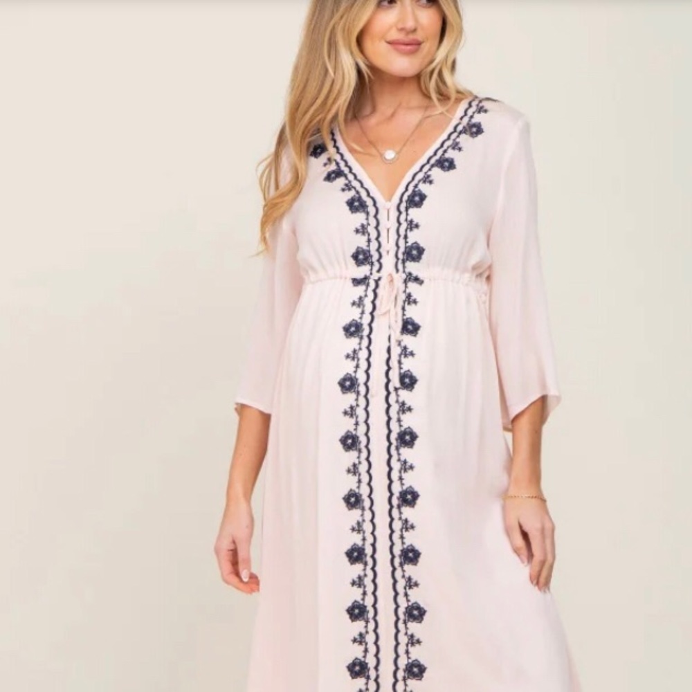Light pink maternity dress with embroidered blue floral designs